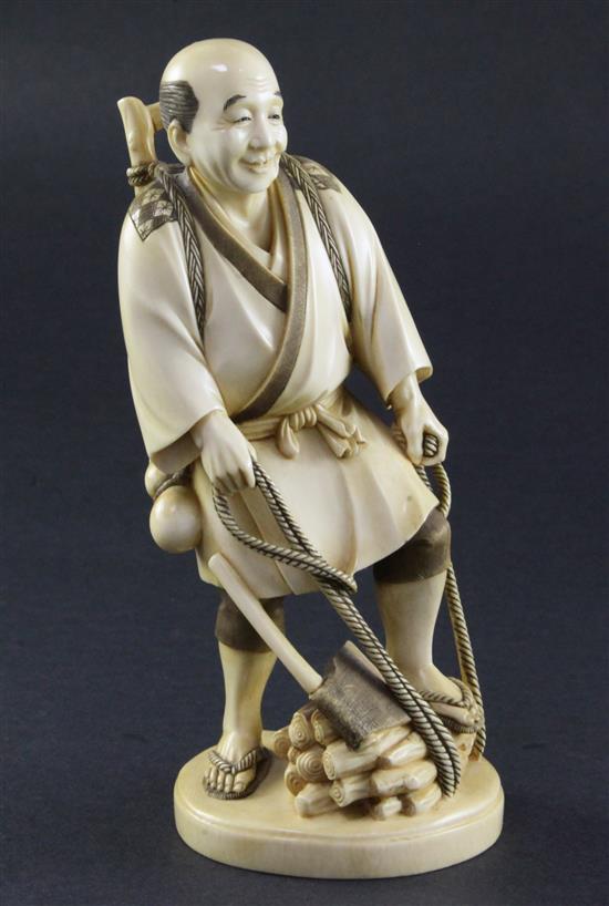 A Japanese ivory figure of a woodsman, early 20th century, 18cm